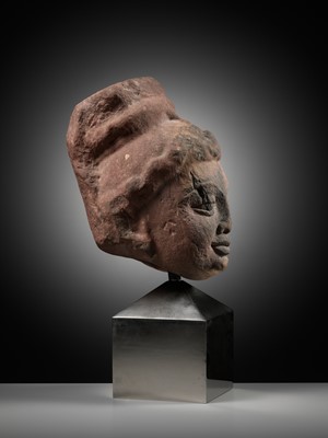 Lot 629 - A RARE MOTTLED RED SANDSTONE HEAD OF A YAKSHI, MATHURA