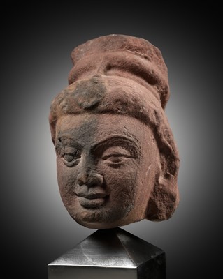 Lot 629 - A RARE MOTTLED RED SANDSTONE HEAD OF A YAKSHI, MATHURA