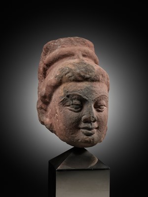 Lot 629 - A RARE MOTTLED RED SANDSTONE HEAD OF A YAKSHI, MATHURA