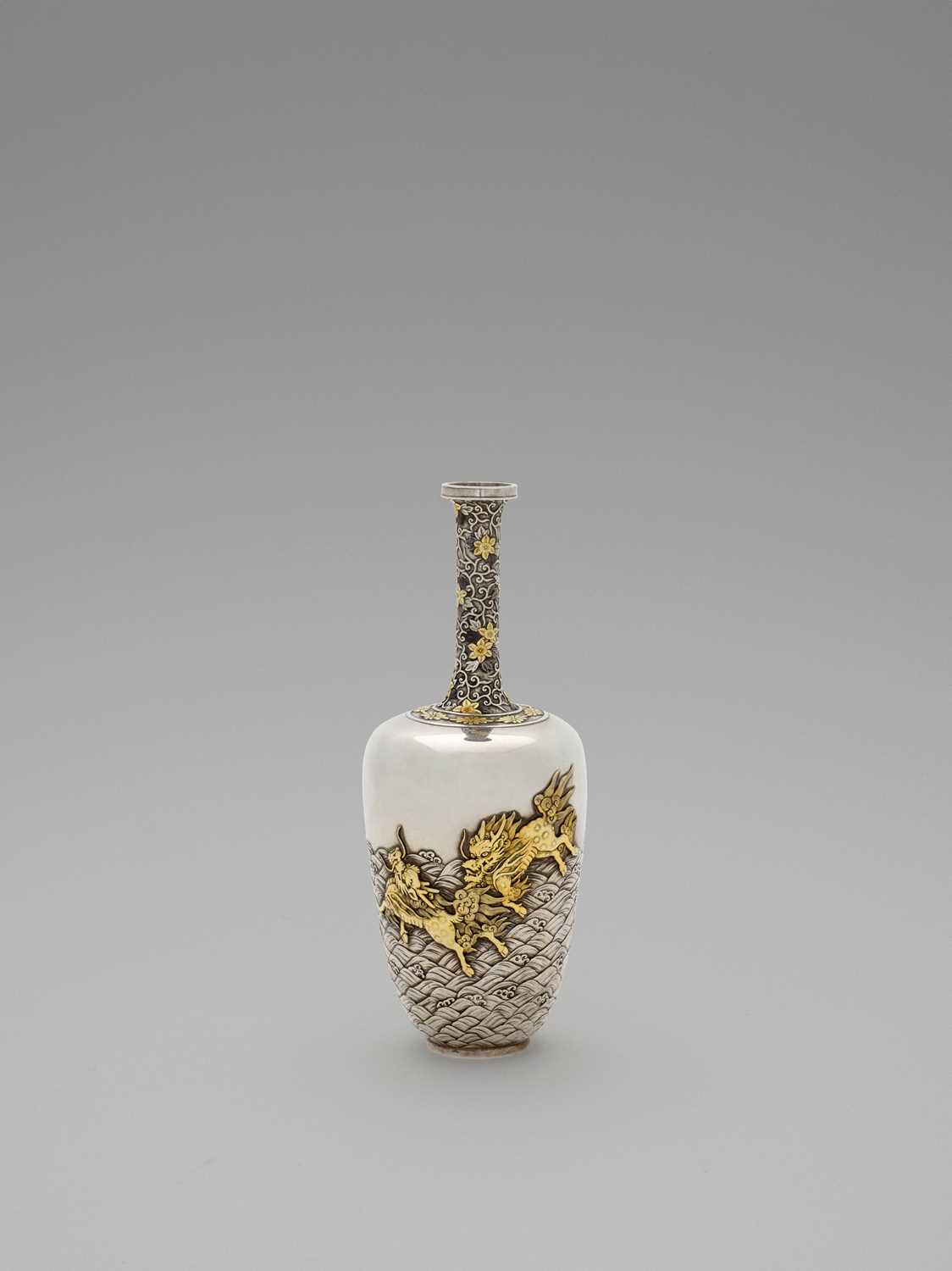 Lot 35 - A SPECTACULAR GOLD-INLAID ‘KIRIN AND WAVES’ SILVER VASE