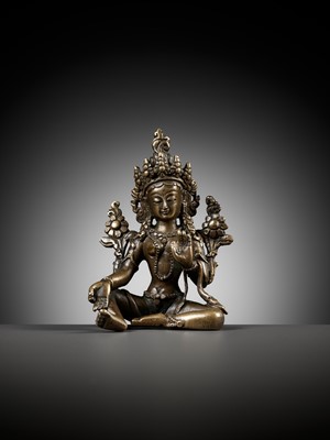 Lot 22 - A COPPER ALLOY FIGURE OF GREEN TARA, NEPAL, 18TH - 19TH CENTURY