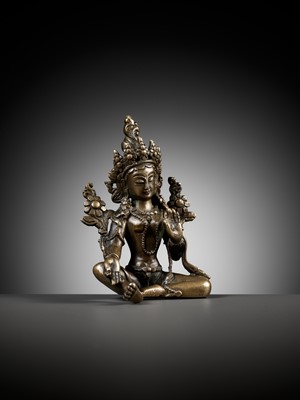 Lot 22 - A COPPER ALLOY FIGURE OF GREEN TARA, NEPAL, 18TH - 19TH CENTURY