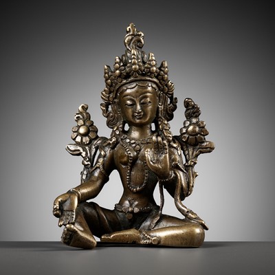 Lot 22 - A COPPER ALLOY FIGURE OF GREEN TARA, NEPAL, 18TH - 19TH CENTURY