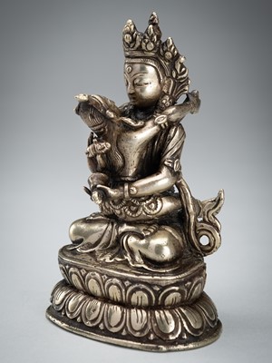 Lot 1482 - A TIBETAN SILVER FIGURE OF VAJRADHARA AND SAMANTABHADRI IN UNION, c. 1900s