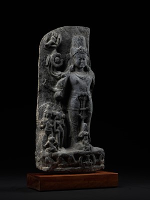 Lot 248 - A LARGE SCHIST STELE OF SURYA, PALA PERIOD, 10TH-12TH CENTURY