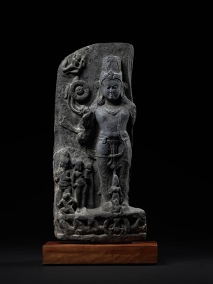 Lot 248 - A LARGE SCHIST STELE OF SURYA, PALA PERIOD, 10TH-12TH CENTURY
