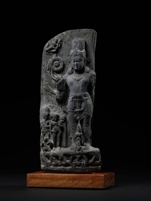 Lot 248 - A LARGE SCHIST STELE OF SURYA, PALA PERIOD, 10TH-12TH CENTURY