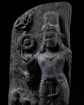 Lot 248 - A LARGE SCHIST STELE OF SURYA, PALA PERIOD, 10TH-12TH CENTURY