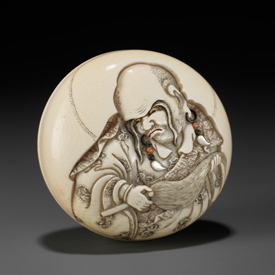 Lot 187 - SUZUKI KOSAI: AN INLAID IVORY MANJU NETSUKE OF A RAKAN