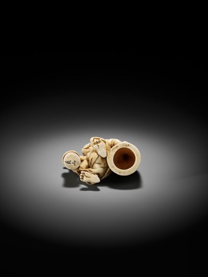 Lot 500 - RYOZAN: AN AMUSING IVORY NETSUKE OF AN ONI CARRYING A BONSHO AND CHOCHIN, CHOCHIN NI TSURIGANE