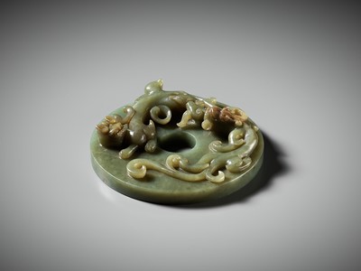 AN ARCHAISTIC GREEN AND RUSSET JADE ‘CHILONG WITH LINGZHI’ BI DISK, MING DYNASTY