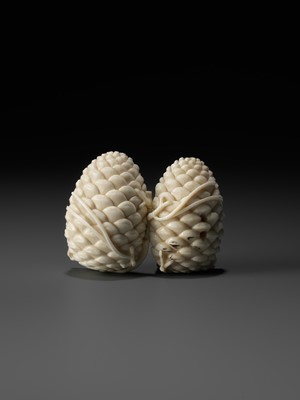 Lot 76 - KAIGYOKU MASATSUGU: A FINE IVORY NETSUKE OF JO AND UBA INSIDE A PINECONE