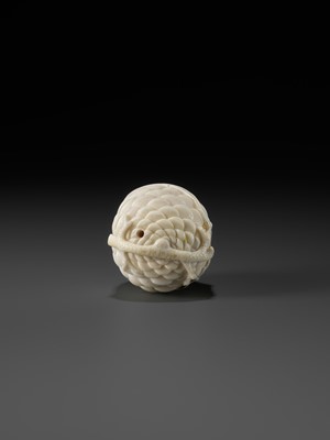 Lot 76 - KAIGYOKU MASATSUGU: A FINE IVORY NETSUKE OF JO AND UBA INSIDE A PINECONE