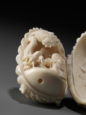 Lot 76 - KAIGYOKU MASATSUGU: A FINE IVORY NETSUKE OF JO AND UBA INSIDE A PINECONE