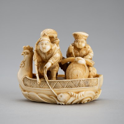 Lot 586 - HOJITSU: AN IVORY NETSUKE OF DAIKOKU AND EBISU ON A BOAT