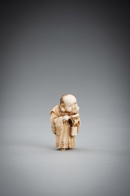 Lot 587 - TOMOKAZU: A FINE IVORY NETSUKE OF FUKUSUKE INSPECTING A NETSUKE ATTACHED TO AN INRO