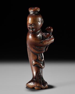 A WOOD NETSUKE OF KAKKYO’S WIFE AND CHILD