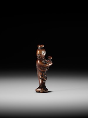 A WOOD NETSUKE OF KAKKYO’S WIFE AND CHILD