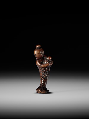 A WOOD NETSUKE OF KAKKYO’S WIFE AND CHILD