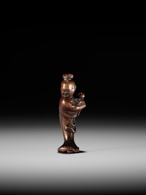 A WOOD NETSUKE OF KAKKYO’S WIFE AND CHILD