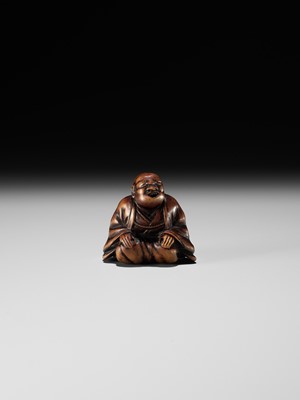 FUJI: A WOOD NETSUKE OF A RAKUGOKA, STORYTELLER