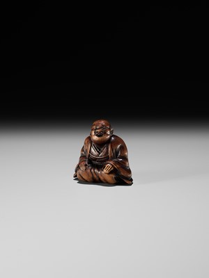 FUJI: A WOOD NETSUKE OF A RAKUGOKA, STORYTELLER