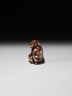 FUJI: A WOOD NETSUKE OF A RAKUGOKA, STORYTELLER