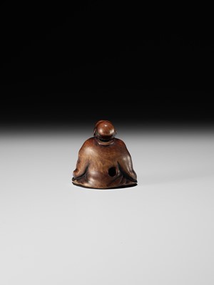 FUJI: A WOOD NETSUKE OF A RAKUGOKA, STORYTELLER