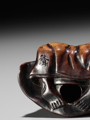 FUJI: A WOOD NETSUKE OF A RAKUGOKA, STORYTELLER