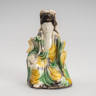 Lot 1720 - A BISCUIT-ENAMELED SANCAI FIGURE OF GUANYIN, 18TH CENTURY