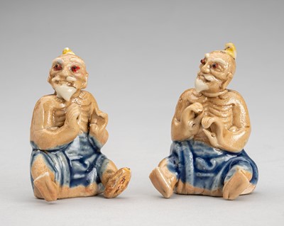 Lot 1735 - A PAIR OF SHIWAN WARE GLAZED STICK HOLDERS, 19TH CENTURY