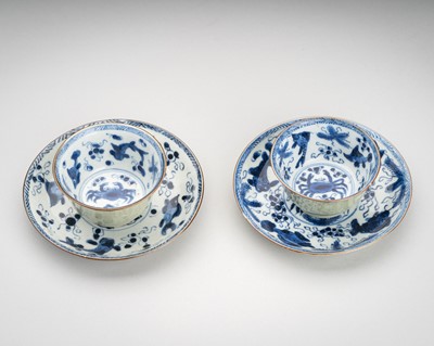 Lot 1936 - A PAIR OF CELADON-GROUND BLUE & WHITE ‘AQUATIC LIFE’ PORCELAIN TEACUPS AND SAUCERS, 18TH CENTURY