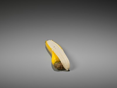 Lot 217 - A STAINED IVORY ‘TROMPE-L’OEIL’ OKIMONO OF A BANANA ATTRIBUTED TO TAKAGI HOSHIN