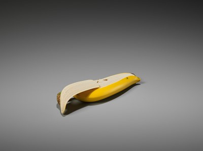 Lot 217 - A STAINED IVORY ‘TROMPE-L’OEIL’ OKIMONO OF A BANANA ATTRIBUTED TO TAKAGI HOSHIN