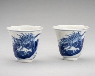 Lot 2015 - A PAIR OF BLUE AND WHITE PORCELAIN CUPS DEPICTING TIGERS HUNTING GOATS, c. 1900s