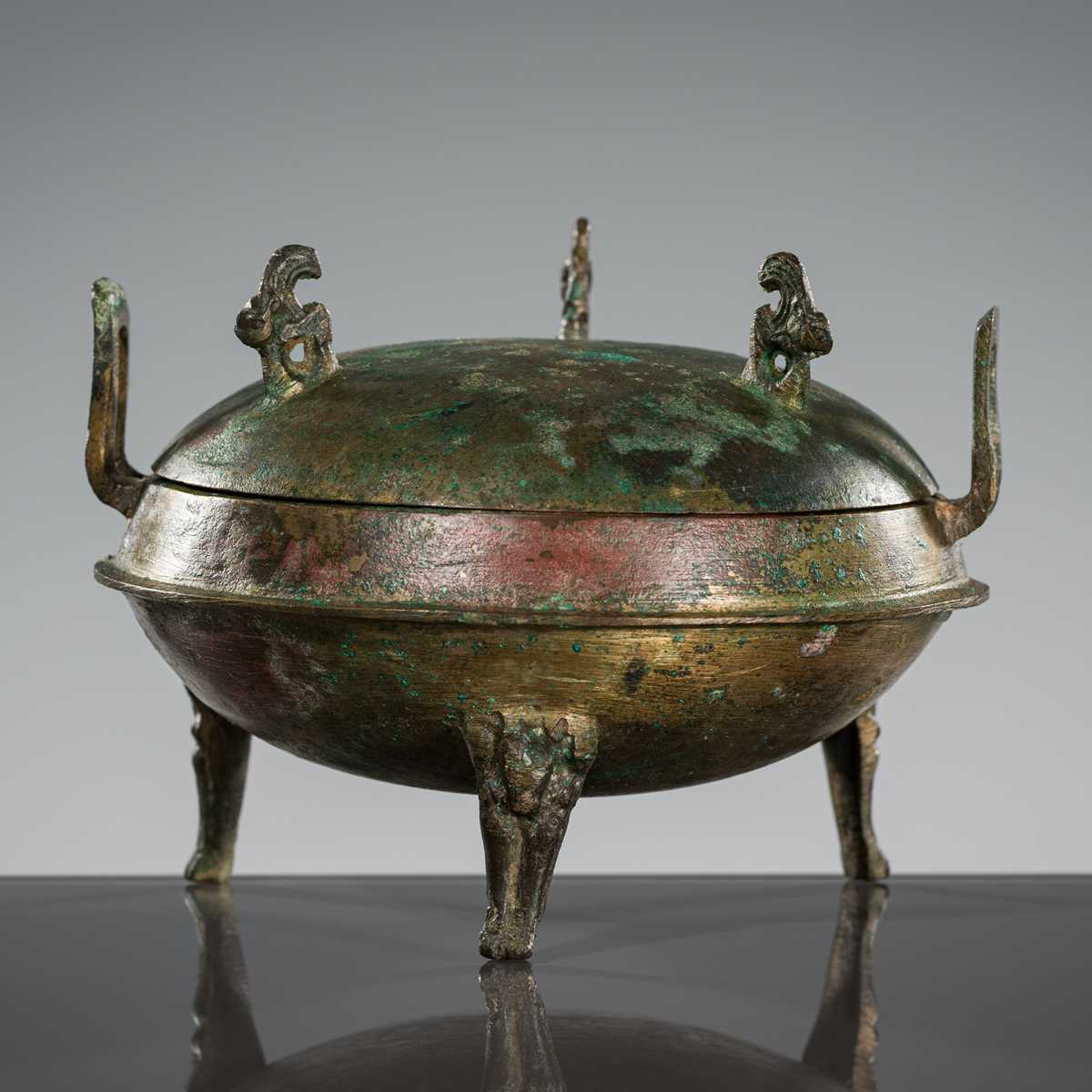 Lot 72 - A BRONZE TRIPOD FOOD VESSEL, DING, HAN DYNASTY