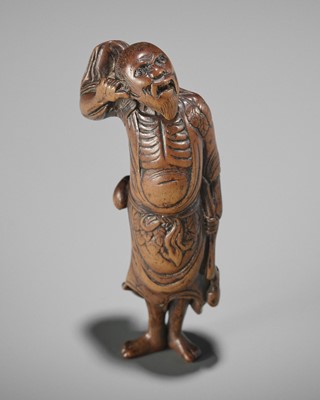 A WOOD NETSUKE OF TEKKAI SENNIN