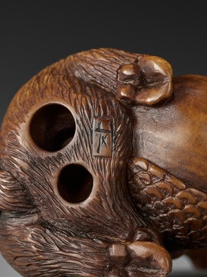 Lot 506 - DERKACHENKO: A WOOD NETSUKE OF A BOAR WITH ACORN
