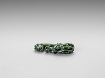 A PAIR OF SPINACH GREEN JADE ‘DRAGON’ BELT HOOKS, LATE QING DYNASTY