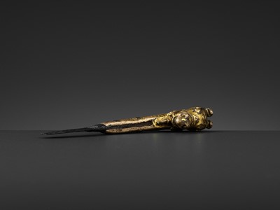Lot 328 - A GILT BRONZE ‘LONGMA’ HILT, XUANDE PERIOD