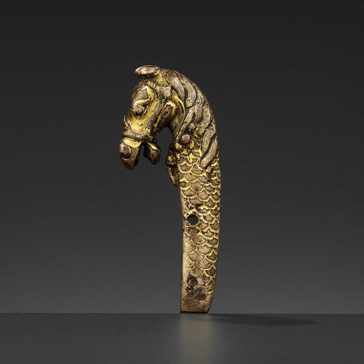 Lot 328 - A GILT BRONZE ‘LONGMA’ HILT, XUANDE PERIOD