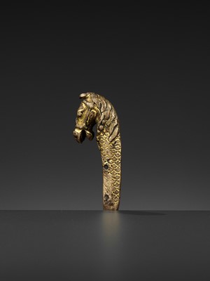 Lot 328 - A GILT BRONZE ‘LONGMA’ HILT, XUANDE PERIOD