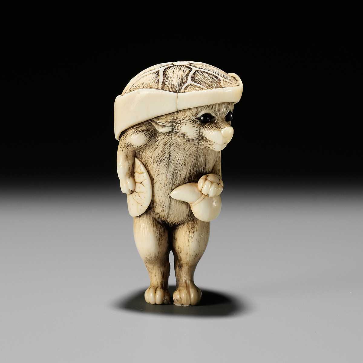 Lot 58 - A HUMOROUS OSAKA SCHOOL IVORY NETSUKE OF TANUKI DISGUISED AS A SAKE VENDOR