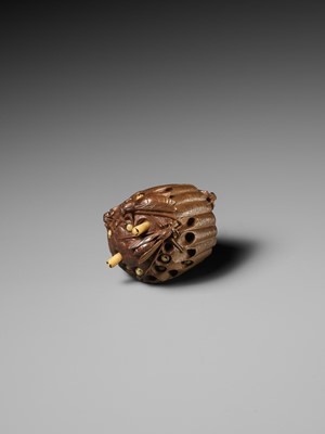 Lot 105 - TADAKAZU: A FINE WOOD NETSUKE OF A WASP NEST WITH MOVABLE LARVAE