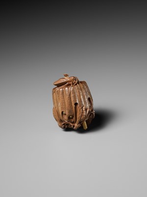 Lot 105 - TADAKAZU: A FINE WOOD NETSUKE OF A WASP NEST WITH MOVABLE LARVAE