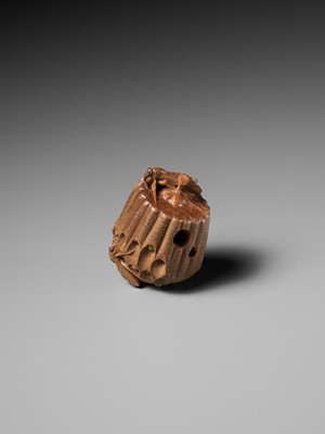 Lot 105 - TADAKAZU: A FINE WOOD NETSUKE OF A WASP NEST WITH MOVABLE LARVAE