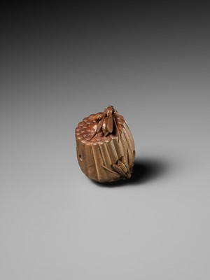 Lot 105 - TADAKAZU: A FINE WOOD NETSUKE OF A WASP NEST WITH MOVABLE LARVAE