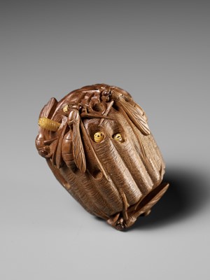 Lot 105 - TADAKAZU: A FINE WOOD NETSUKE OF A WASP NEST WITH MOVABLE LARVAE