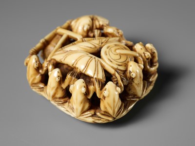 Lot 493 - SEIMIN: A FINE WALRUS TUSK NETSUKE OF TEN FROG MUSICIANS ON A SANDAL