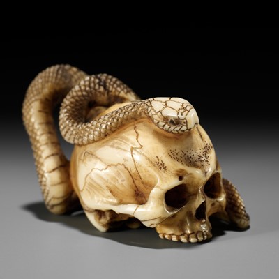 Lot 96 - A FINE IVORY NETSUKE OF A SKULL WITH A SNAKE